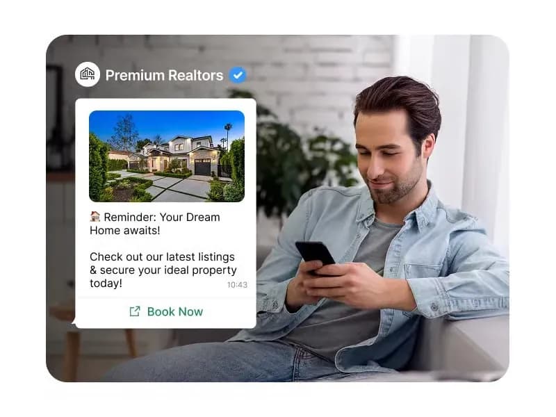 Home buyer reading a WhatsApp reminder from a real estate business with a Book Now button